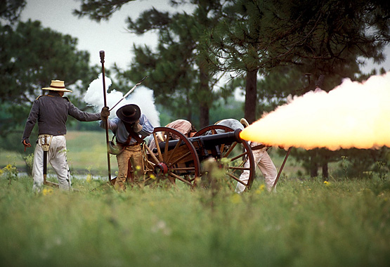Texas reenactment actors firing a canon