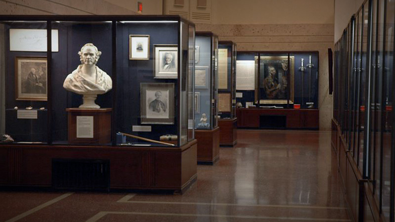 Antique display cases full of artifacts at the San Jacinto Museum