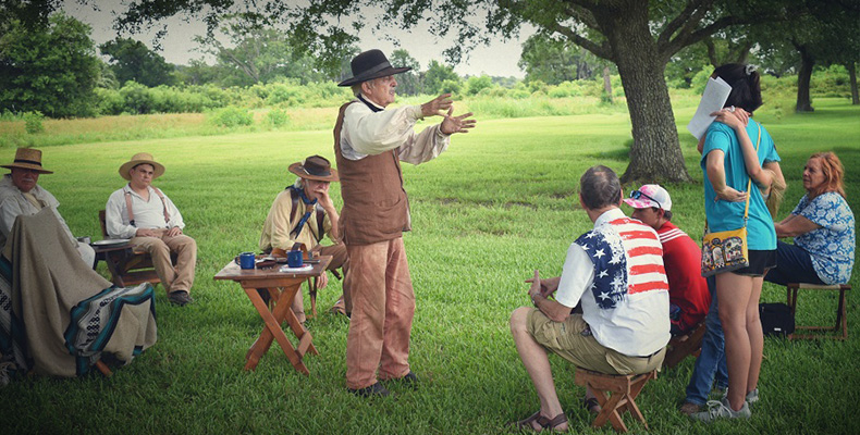 A living history reenactor tries to recruit some modern people for the Texian army.