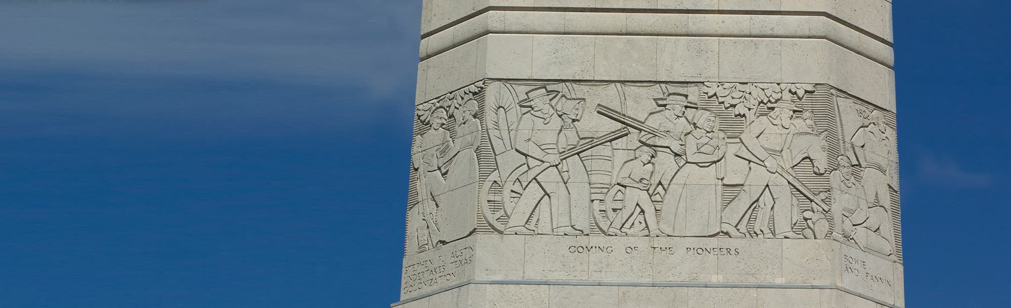 The side of the San Jacinto Monument depicting the arrival of the pioneers to Texas