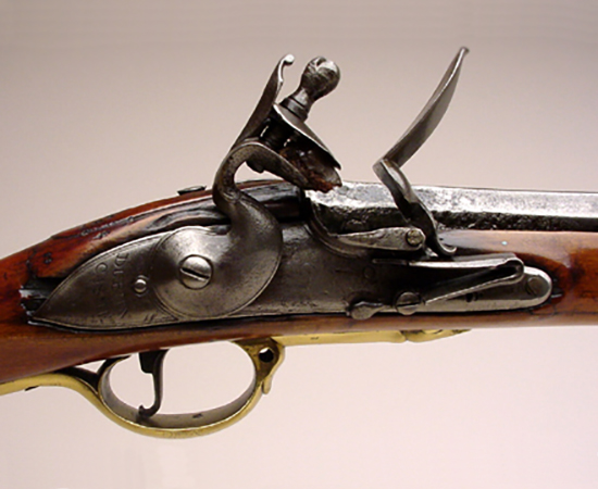 Detail slowing the lockplate of a Brown Bess India Pattern Musket