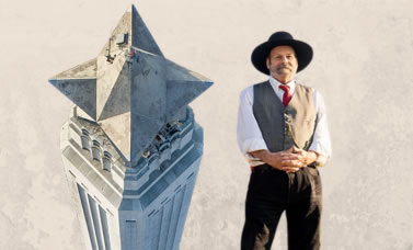 A man wearing a dark hat and a vest is pictured beside the top of the San Jacinto Monument