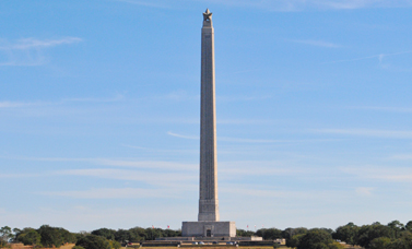 Photograph of the San Jacinto Monument against a blue sky