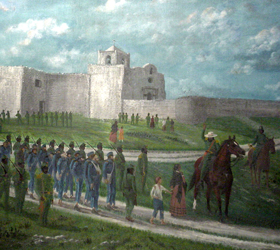 Luminaries line the sides of the Revlection pool, with the San Jacinto Monument in the background.