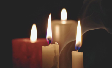 Lit candles at a graveyard tour