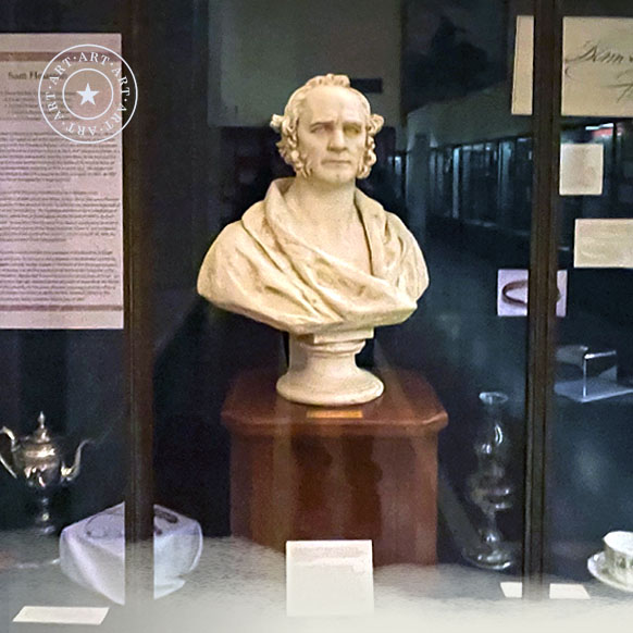 Sam Houston bust displayed with many other of the General’s artifacts in a display case at the San Jacinto Museum